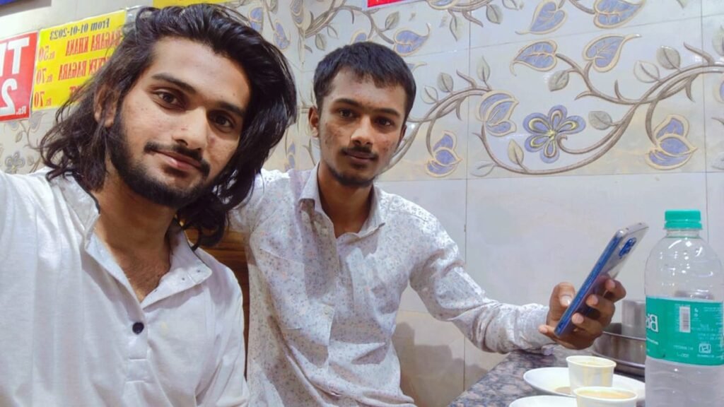 Shaik Gaffar Ali taking a selfie with a friend
